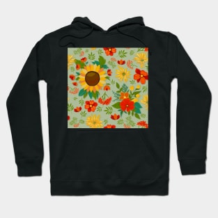 Autumn pattern with sunflowers and berries on light green Hoodie